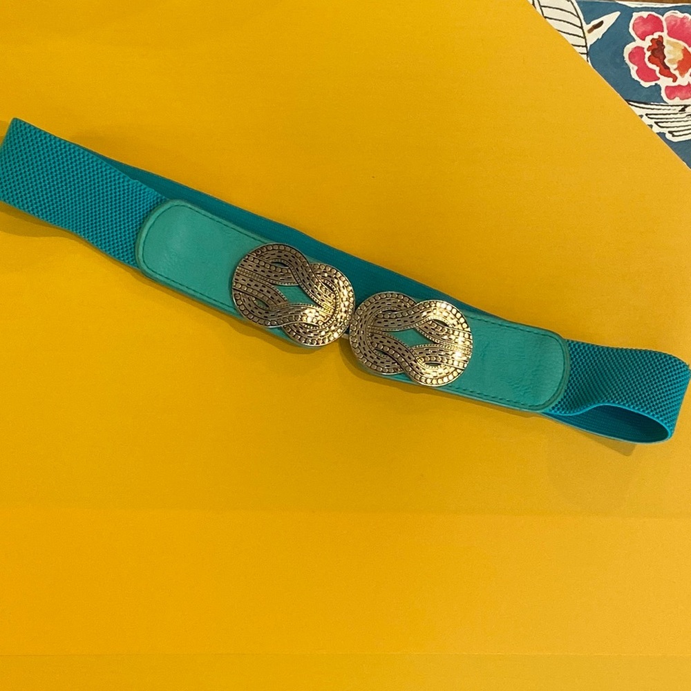 Woman’s teal waist latch belt